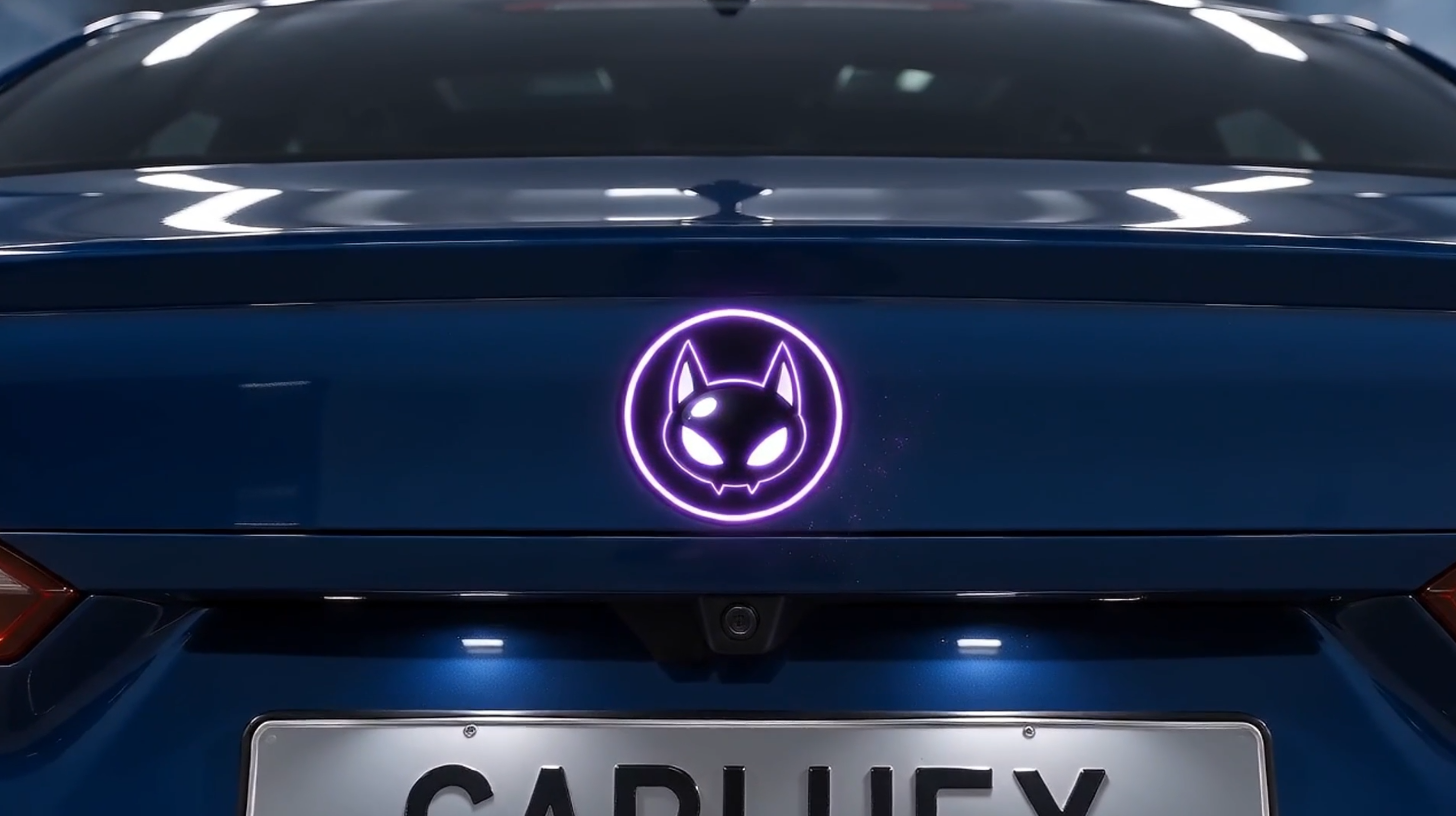 Straight-on view of a BMW rear with a digital emblem